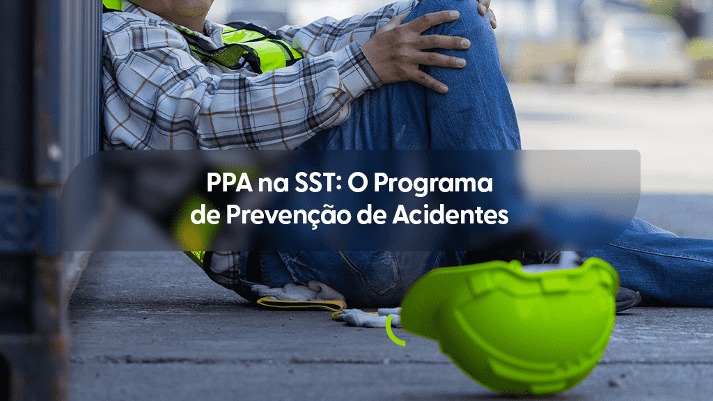 Trabalhador sentado no chão de obra ao lado de capacete, ilustrando a importância do PPA na SST para evitar acidentes de trabalho.